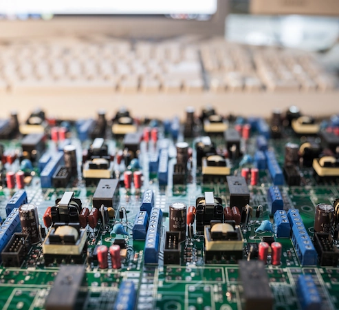circuit board in front of computer